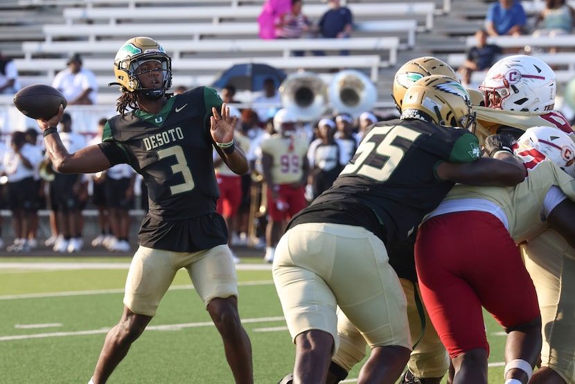 DeSoto High’s QB Kelden Ryan throws the ball during the second half of a football game...