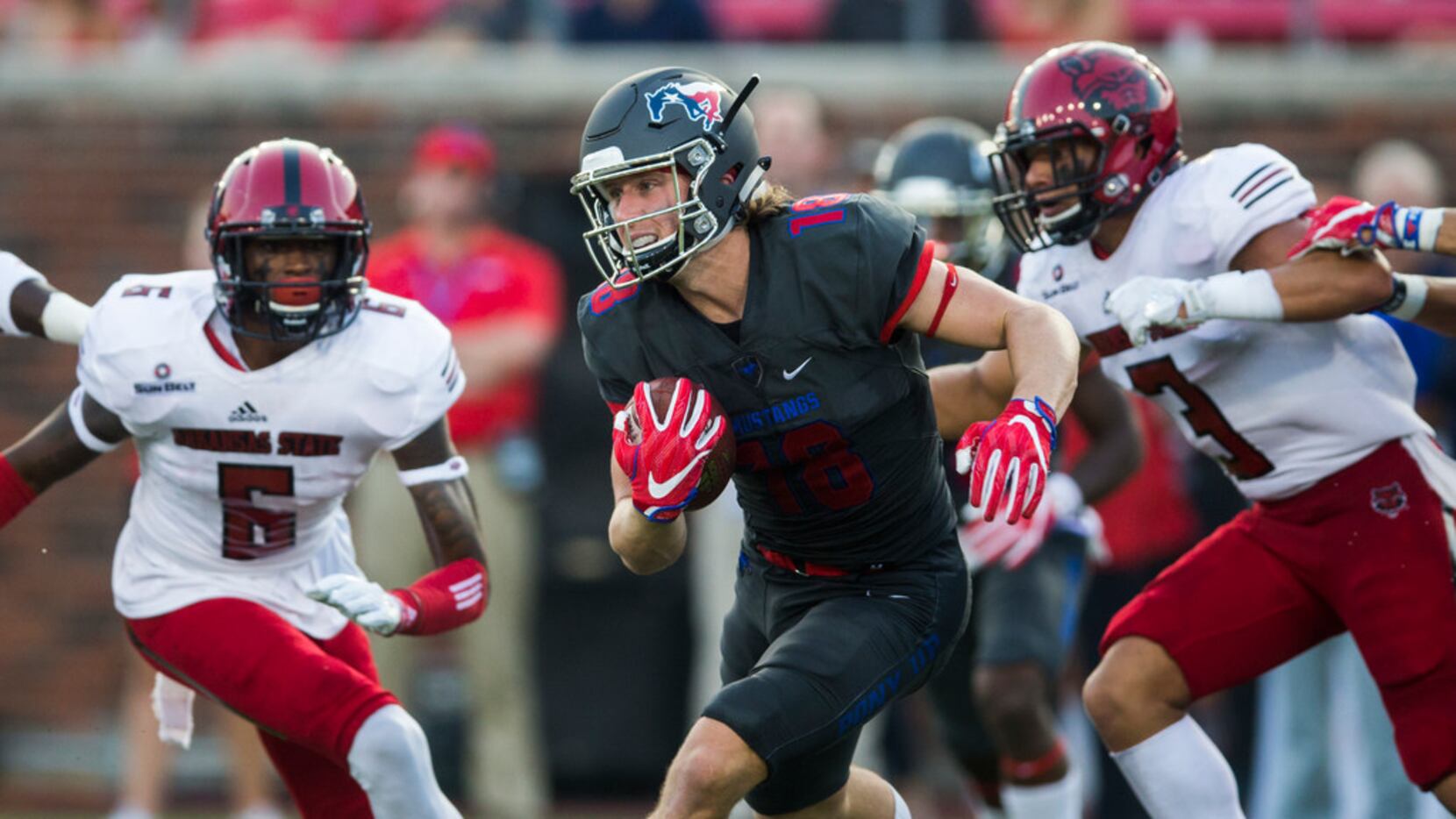 Southern Methodist Mustangs wide receiver Trey Quinn (18) runs the ball during the first...