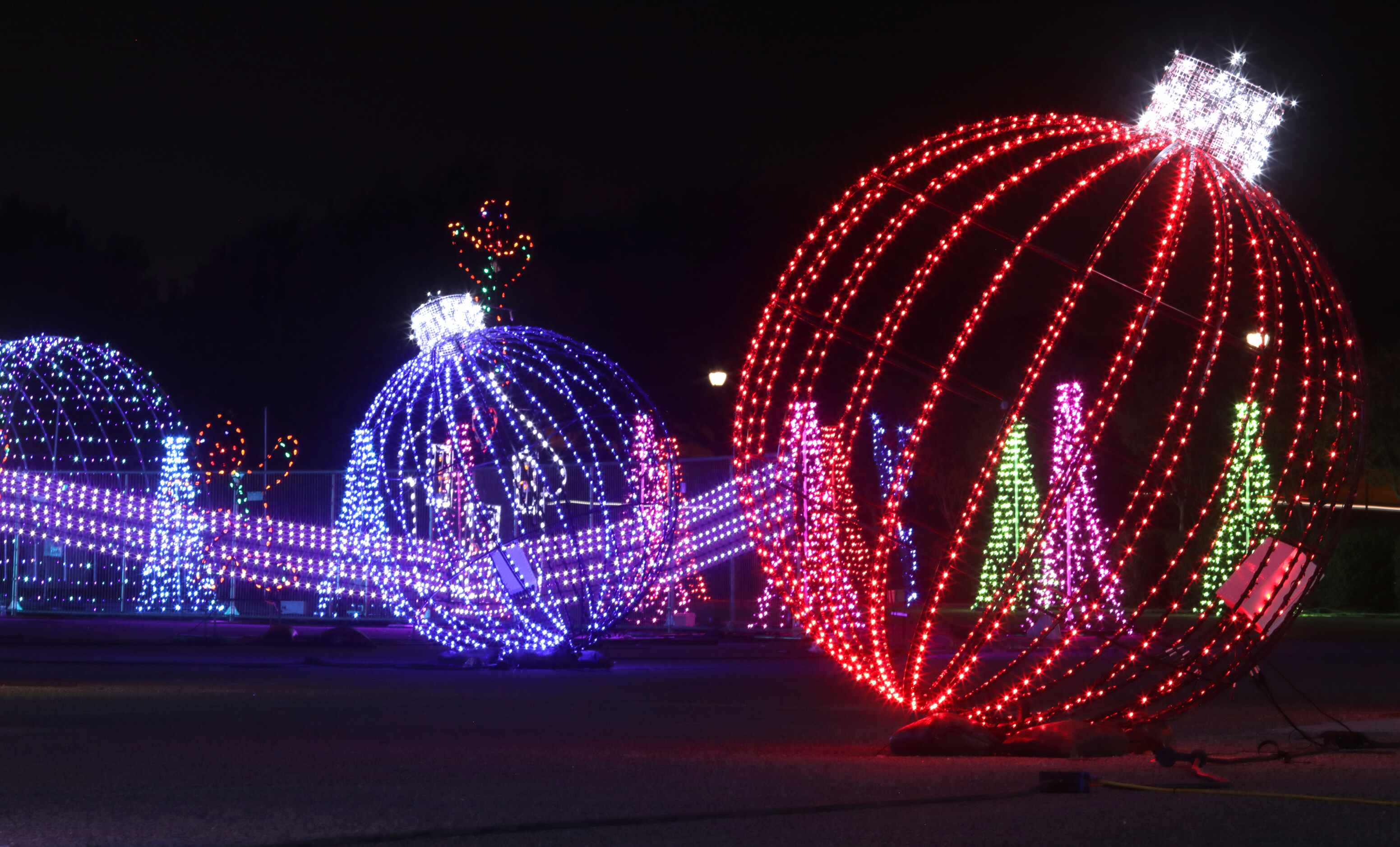 At Radiance: Frozen in Frisco, guests ride a Holly Jolly Trolley (a theme park-style tram)...