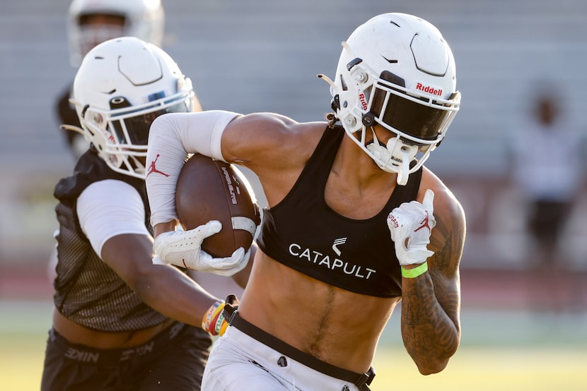 Lewisville wide receiver Jaydan Hardy runs after a catch during the first day of practice at...