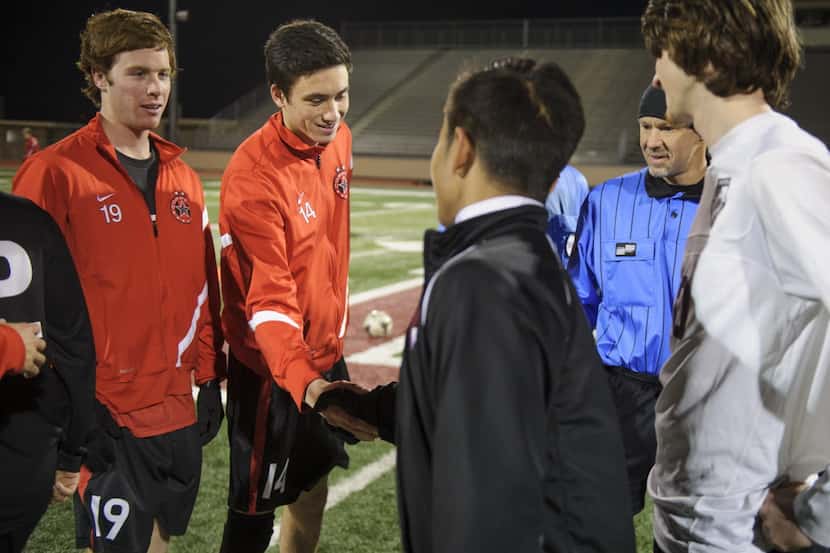 Kellen Reid (second left), a senior at Coppell High School and a captain of the soccer team,...