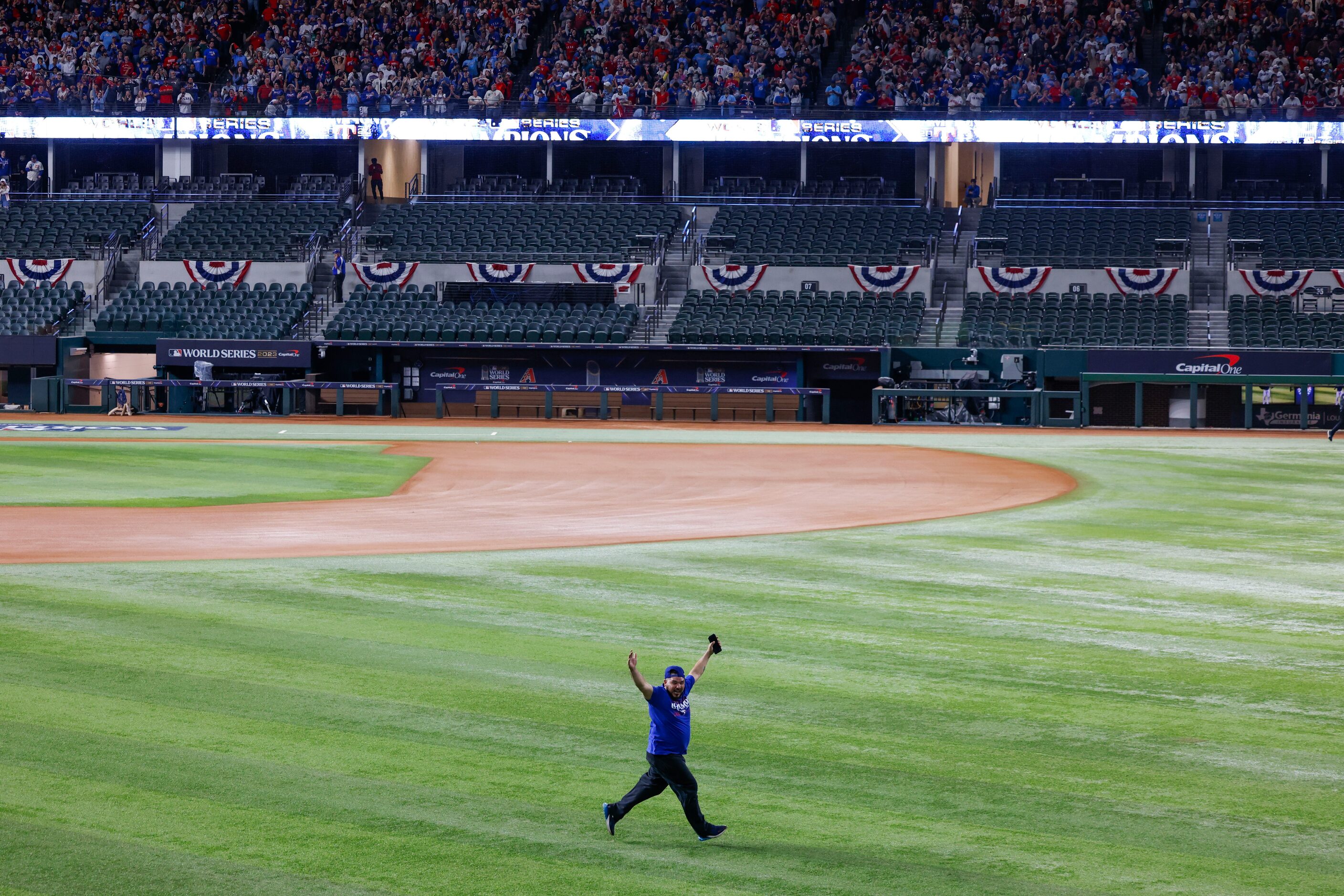 Some Texas Rangers fans ran onto the field following Texas Rangers’ winning the World Series...