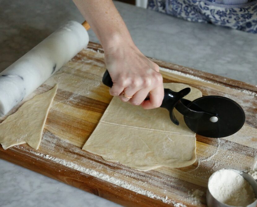 Using a pizza cutter, cut the dough into small squares. 