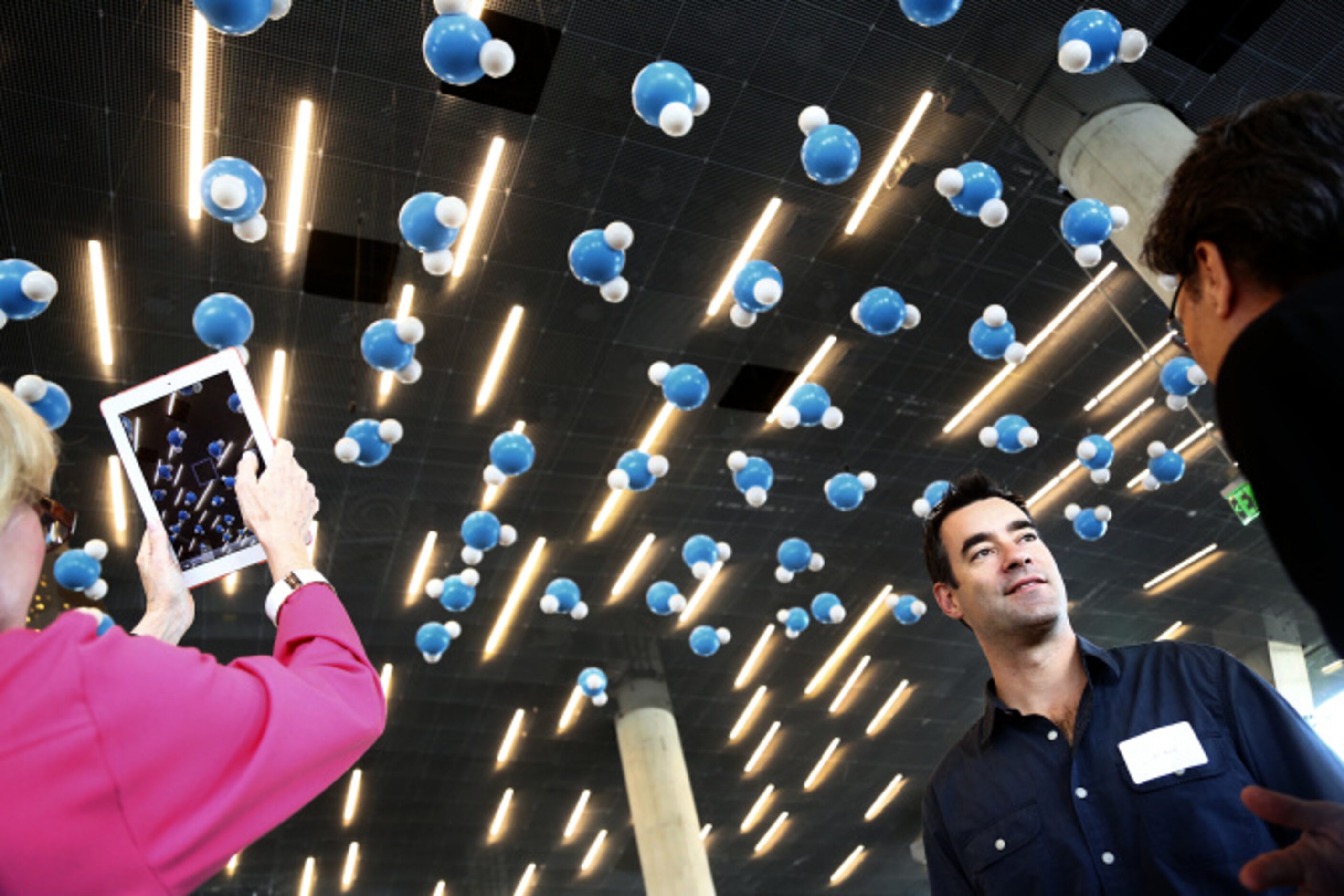 Rosewood Hotels representative Sean Burpee learns of the Dancing Water interactive spheres...