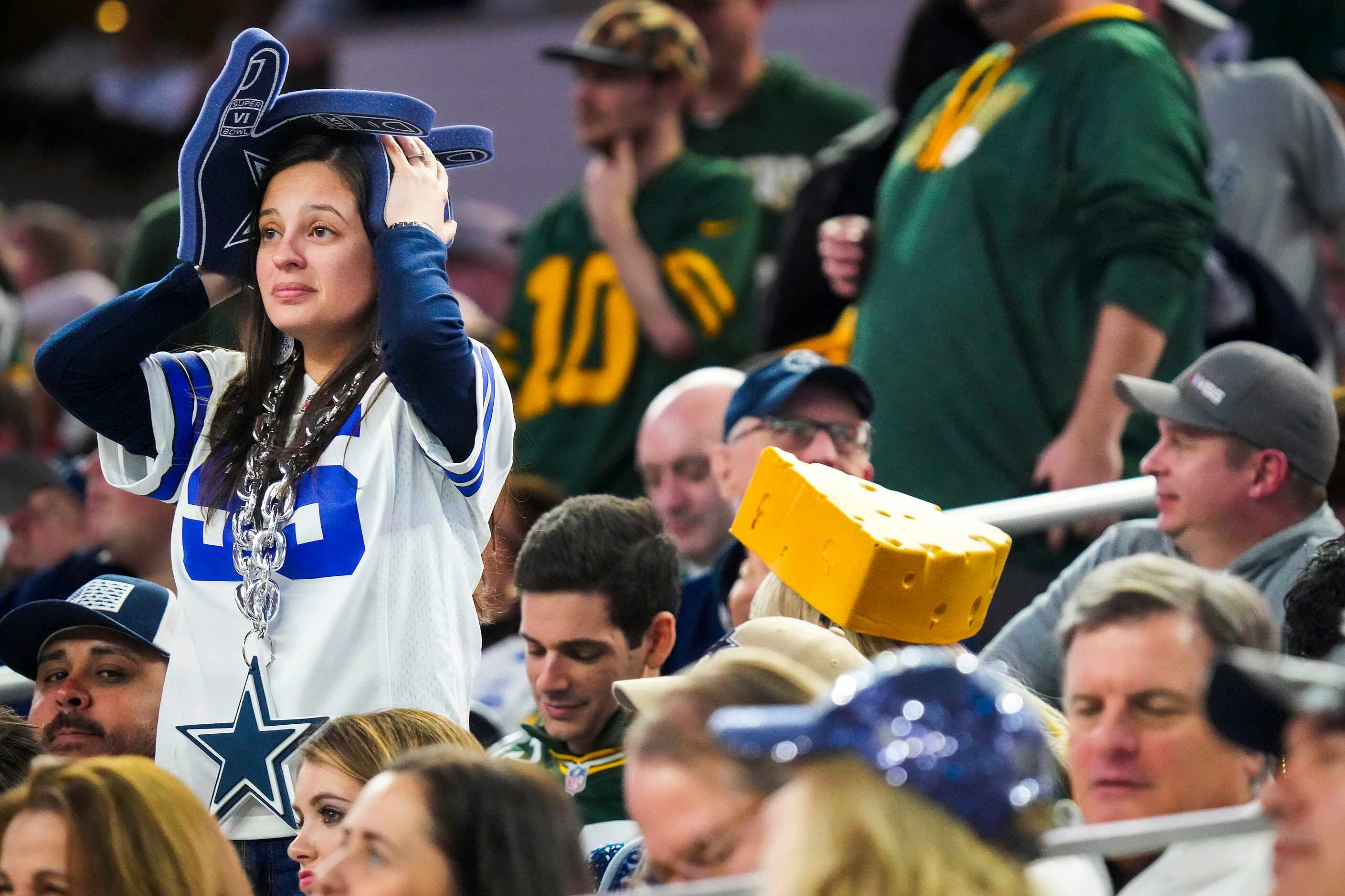 A Dallas Cowboys fan reacts after a touchdown by Green Bay Packers tight end Luke Musgrave...