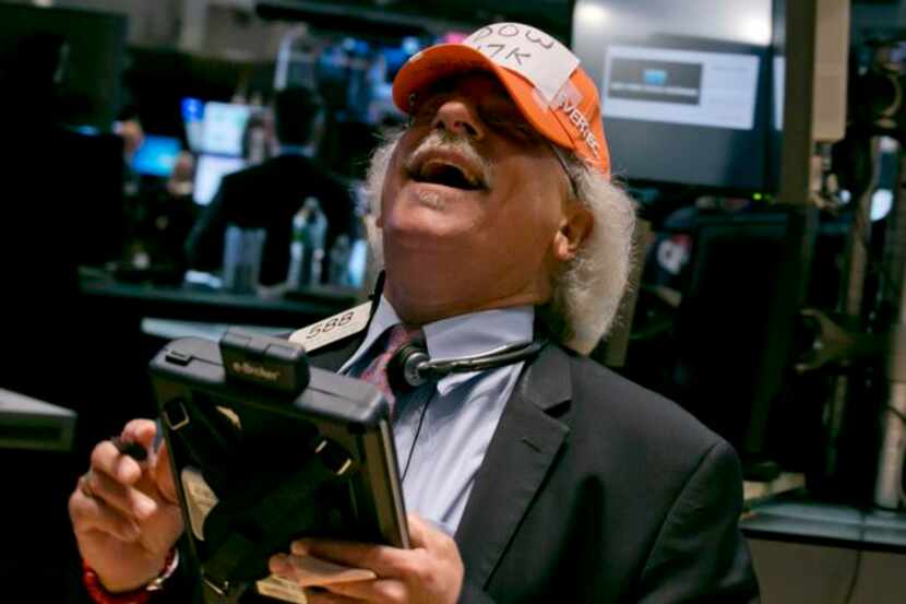 
A trader at the New York Stock Exchange was goofing around July 1 with his “Dow 17,000”...