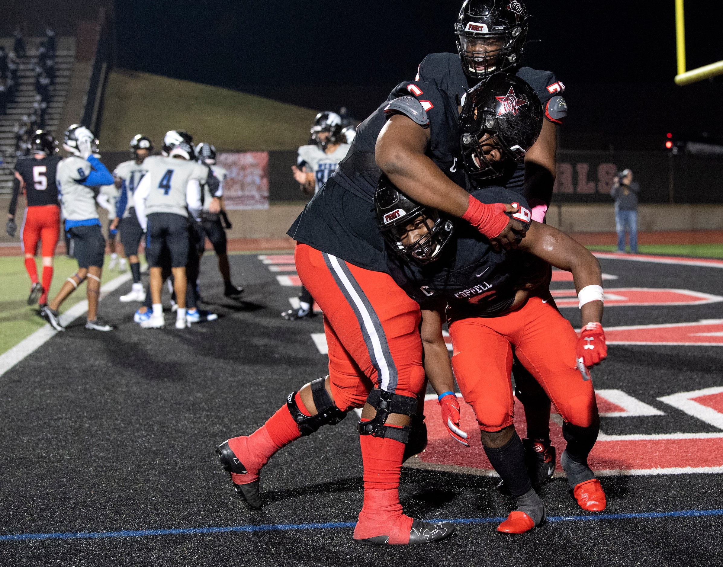 Coppell senior offensive lineman Febechi Nwaiwu (54), left, and junior offensive lineman...