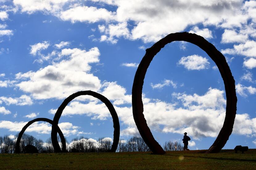 At the North Carolina Museum of Art's 164-acre Ann and Jim Goodnight Museum Park, a runner...