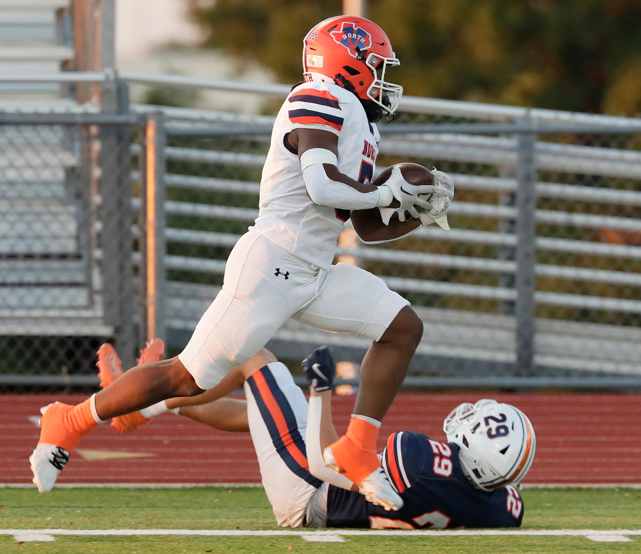 McKinney North High School running back Greg Ard (5) is run out of bounds near the goal line...