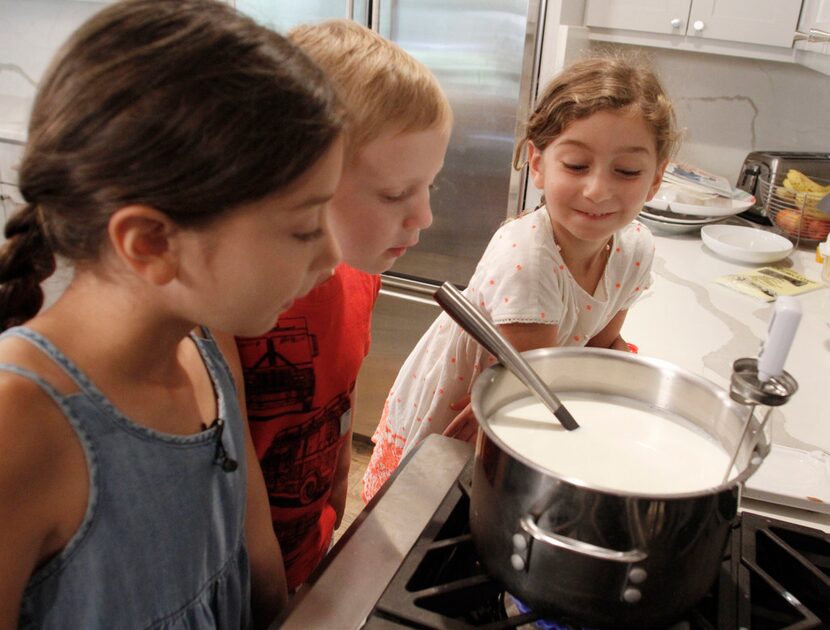 Eight-year-old Sophie Massad, 5-year-old Sam Booke and 5-year-old Adele Massad wait for...