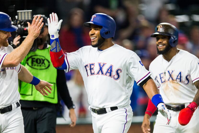 Texas Rangers shortstop Elvis Andrus (1) celebrates a home run during the fifth inning of an...