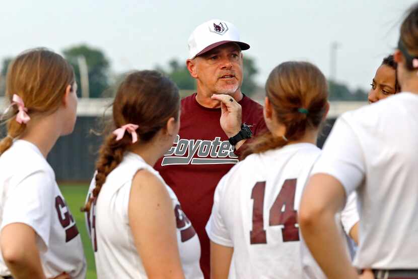 Heritage head coach Tim O'Brien talks to his players after their victory tied the series as...