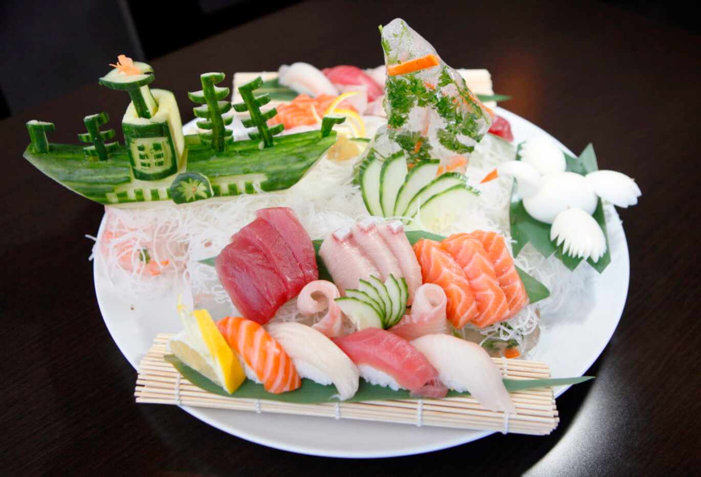The Katana sushi and sashimi combo, with salmon, tuna, yellowtail and J. red snapper, is...
