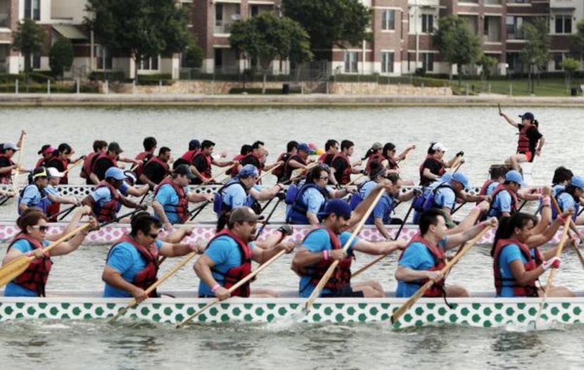 
Teams compete in the dragon boat races at the DFW Dragon Boat, Kite and Lantern Festival in...