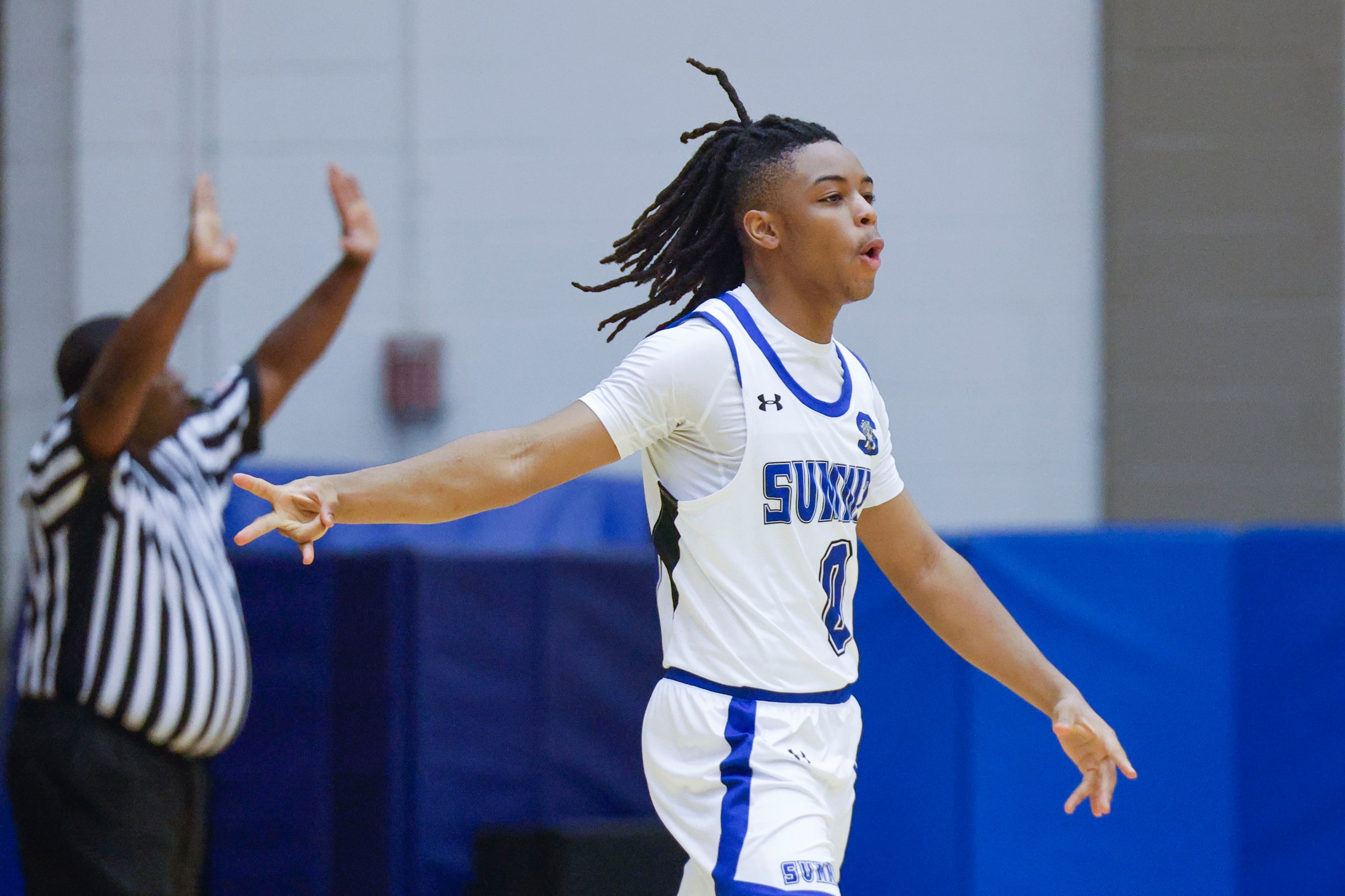 Mansfield Summit’s Derrick Brown celebrates a three-pointer against Denton Ryan during the...