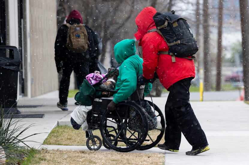 People made their way to Austin Street Center for warmth as snow fell Thursday, Dec. 22,...