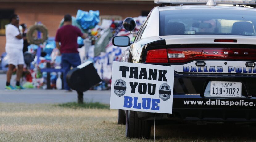 On the last day of the police memorial, citizens pay their respects to five fallen officers...