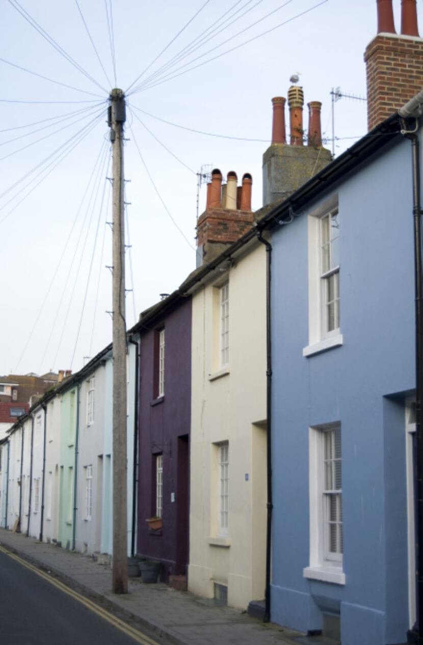 Charming parti-colored flats line the residential quarter of the North Laine district in...