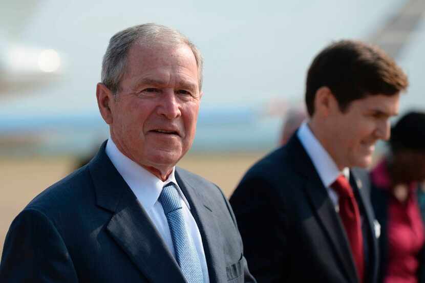Former US President George W. Bush arrives for an official visit to Botswana, in Gaborone on...