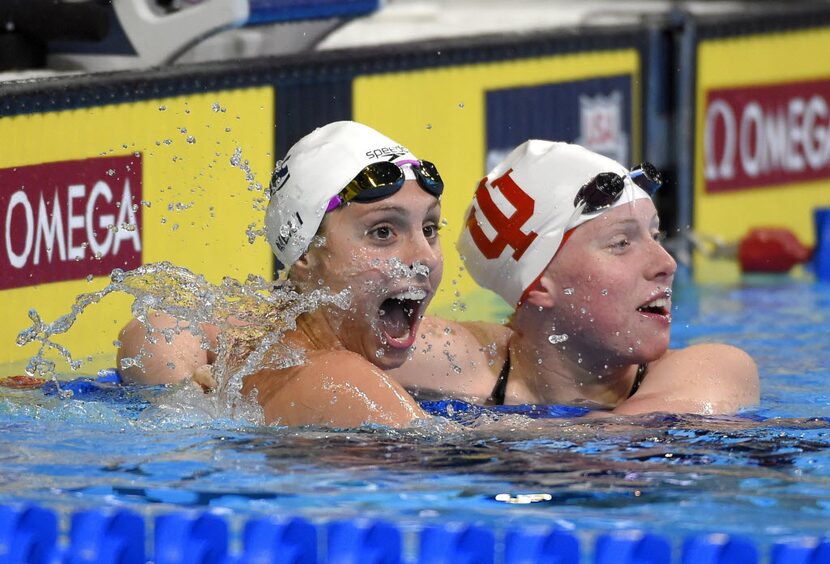 Lilly King, right, celebrates with Katie Meili after winning the women's 100-meter...