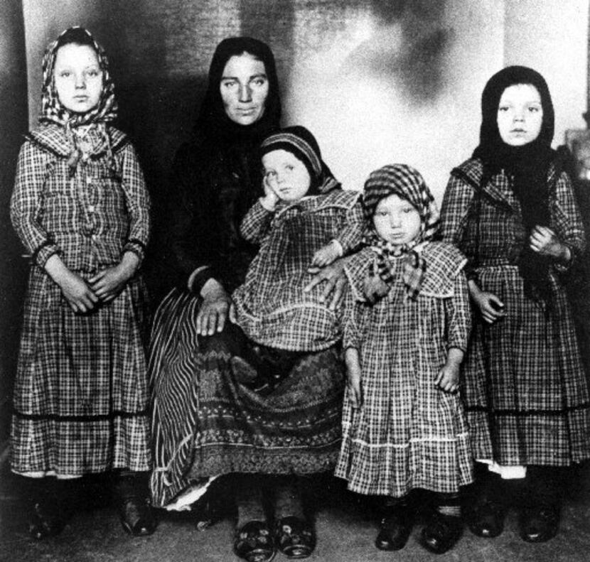 A Hungarian mother and her four children pose after their arrival in 1909 at Ellis Island in...