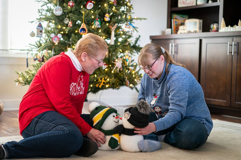 Kathleen Krueger plays with her daughter, Megan, 28, at their home in Racine, Wis., Friday,...