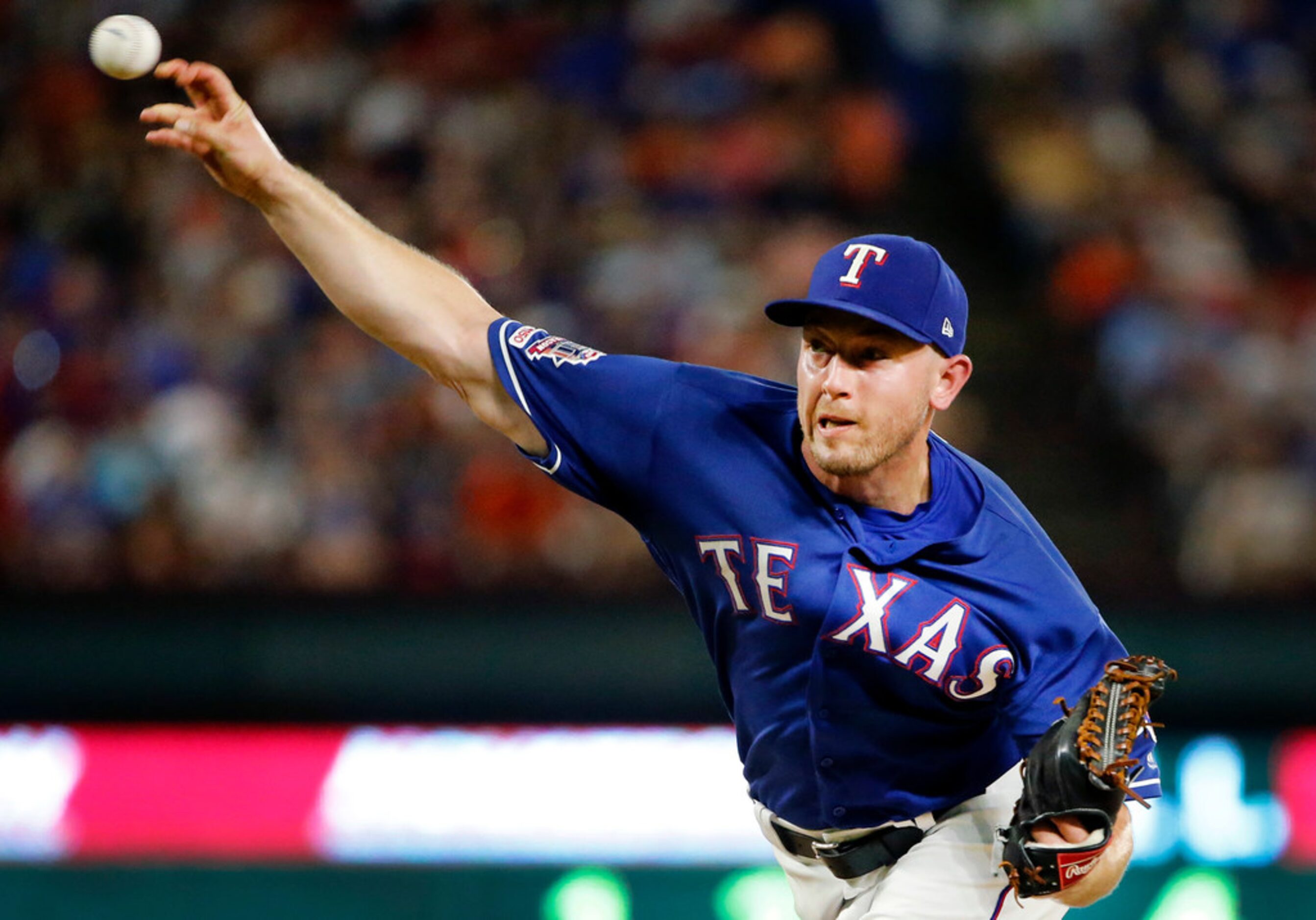 Texas Rangers starting pitcher Adrian Sampson (52) throws against the Houston Astros in the...