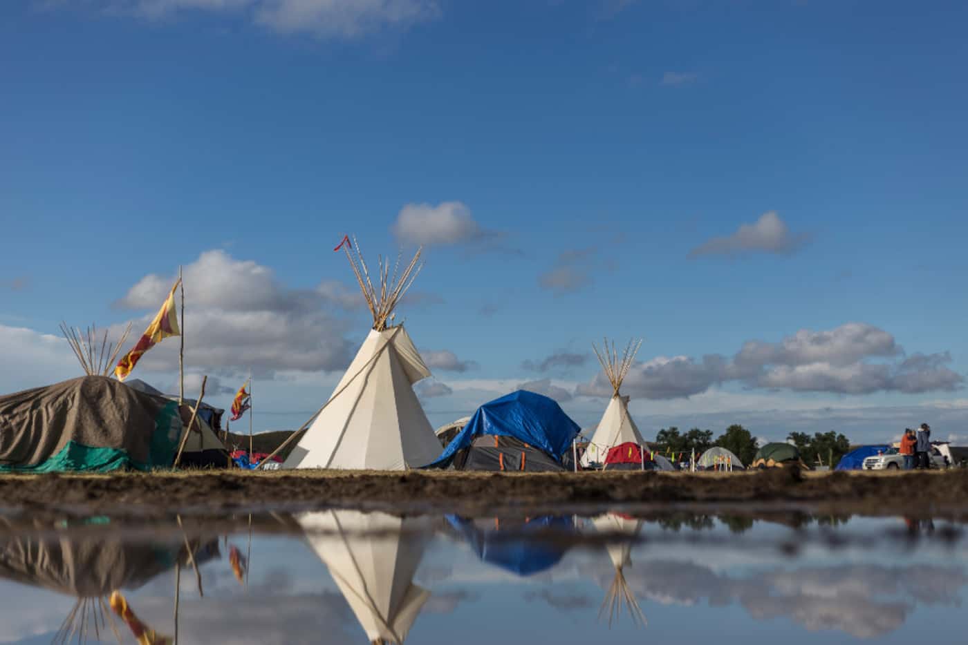 Reflection of inside of Oceti Sakowin camp after the rain in Cannonball, North Dakota on...