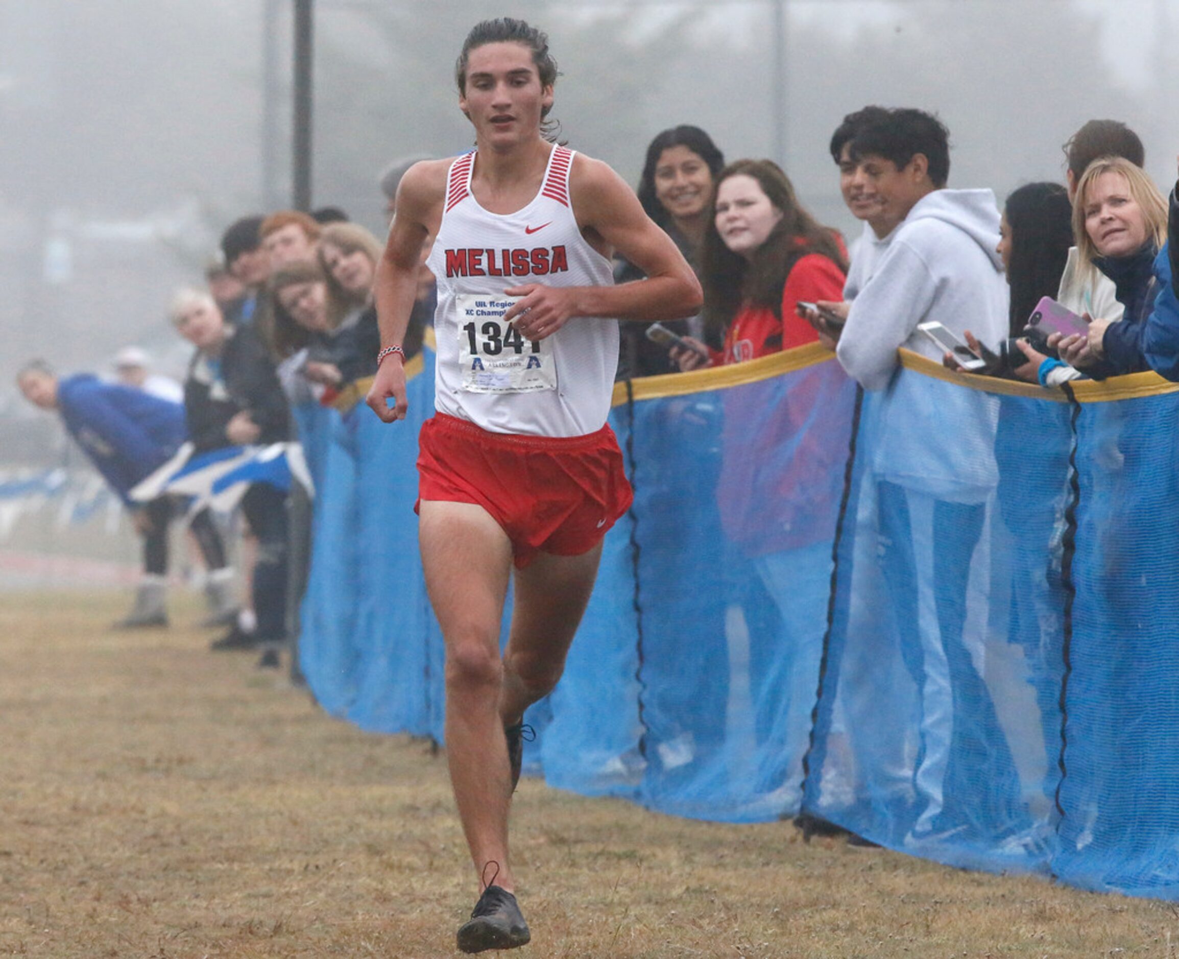 Melissa High School's Judson Greer nears the finish line in first place in the boys 4A...