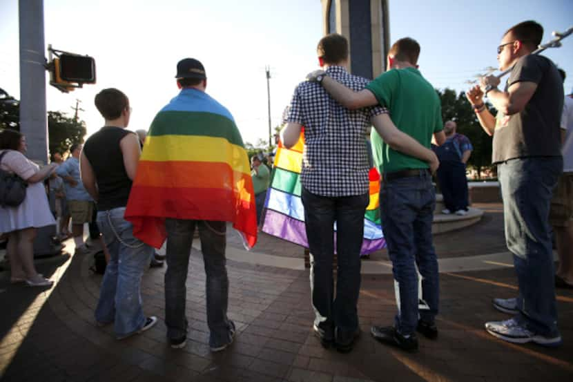 Participants listen to speakers during a rally in Oak Lawn, planned as a protest of North...