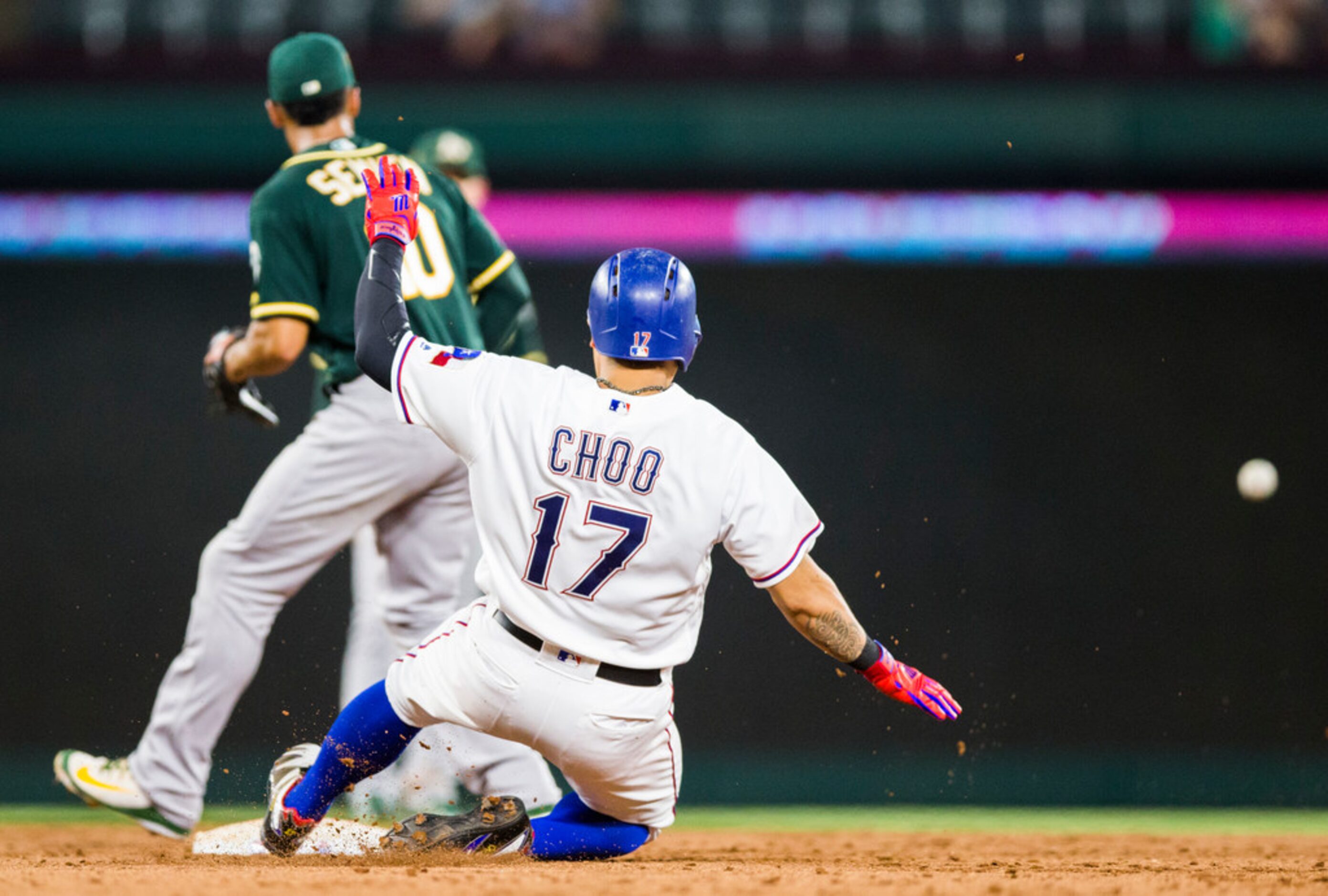 Texas Rangers right fielder Shin-Soo Choo (17) slides safely in to second base as Oakland...