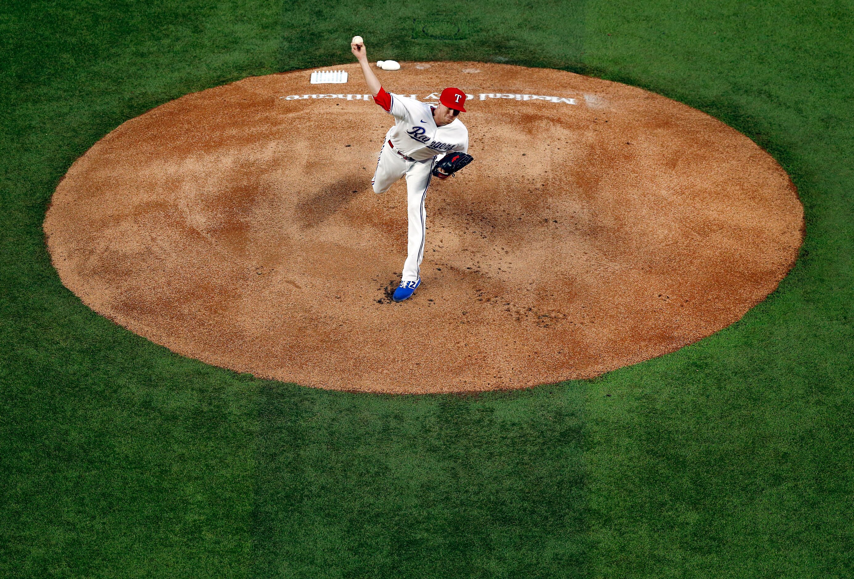 Texas Rangers starting pitcher Kyle Gibson (44) throws against the Seattle Mariners in the...