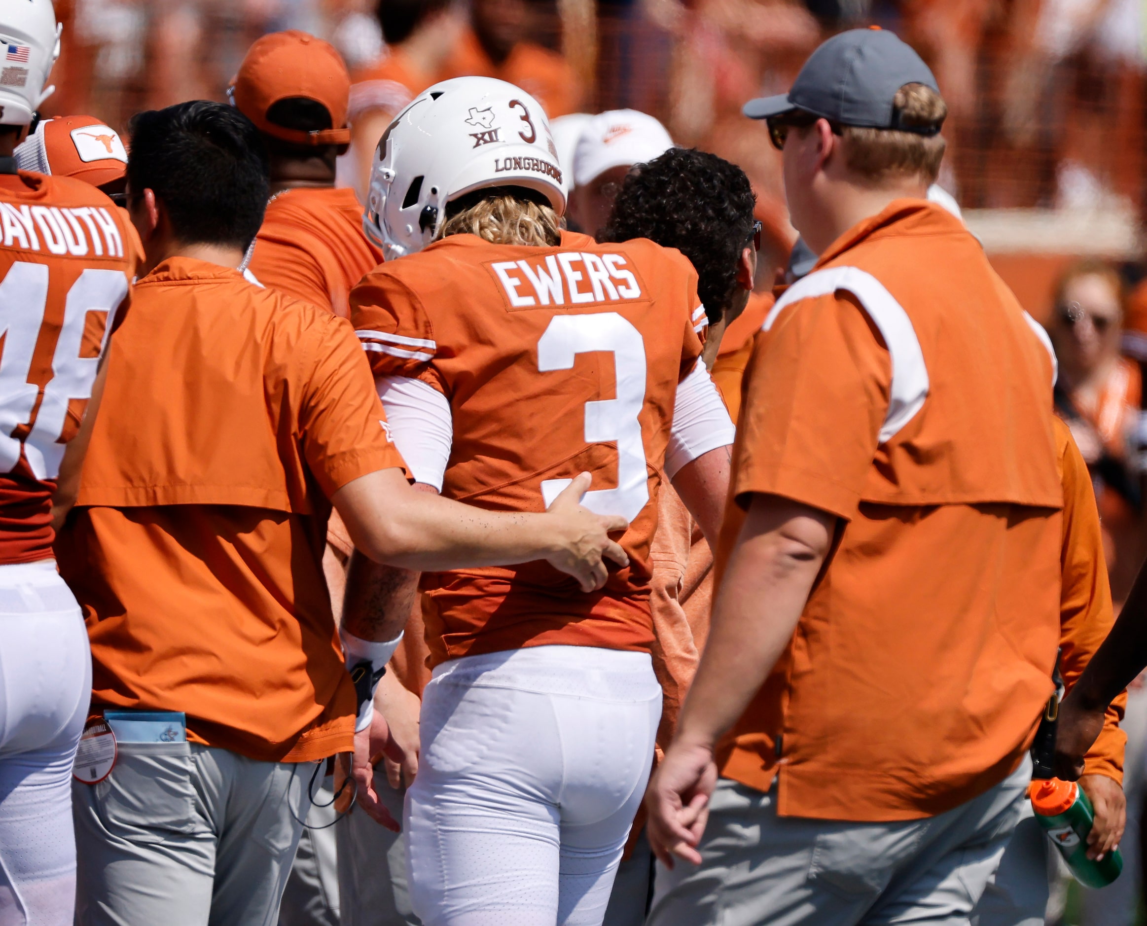 Texas Longhorns quarterback Quinn Ewers (3) walks off the field after he took a hard hit...