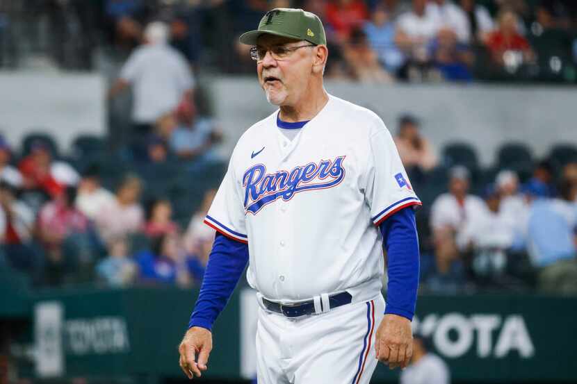 Texas Rangers manager Bruce Bochy walks to the dug out during a baseball game against...