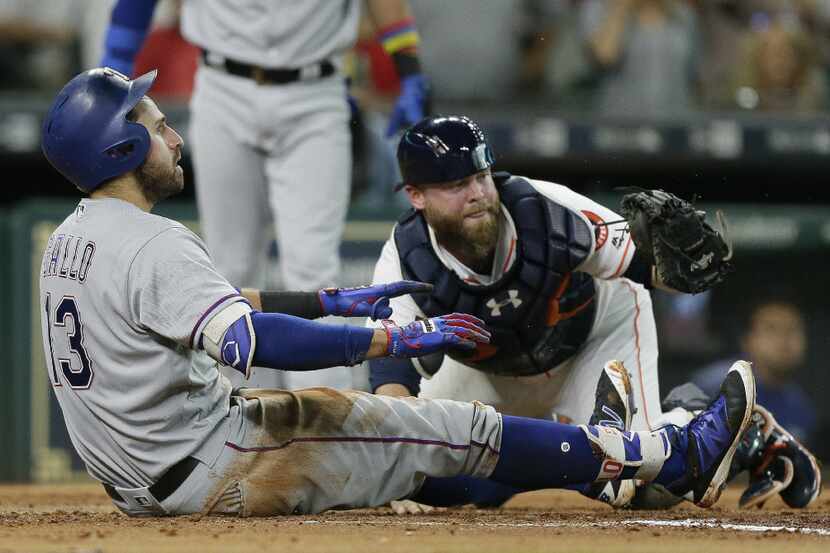 HOUSTON, TX - JUNE 12:  Joey Gallo #13 of the Texas Rangers is tagged out by Brian McCann...