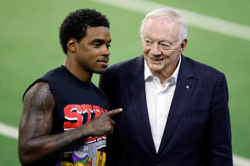 Dallas Cowboys owner Jerry Jones (right) poses for photos with professional boxer Errol...