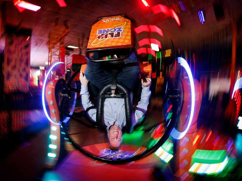 Urban Air Adventure Park CEO Michael Browning takes a spin in the Spin and Flip Zone at its...