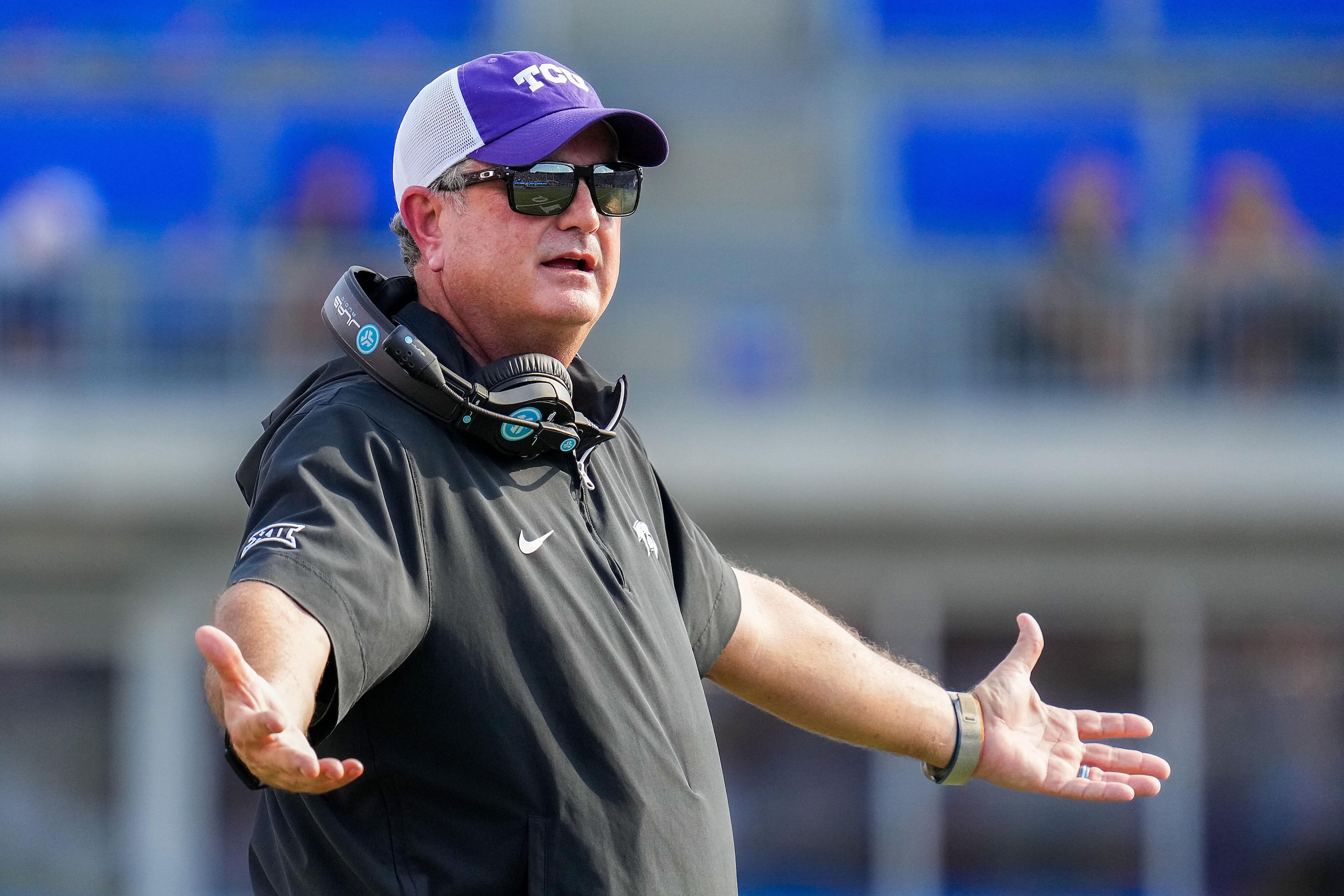 TCU head coach Sonny Dykes reacts to a call during the first half of an NCAA football game...