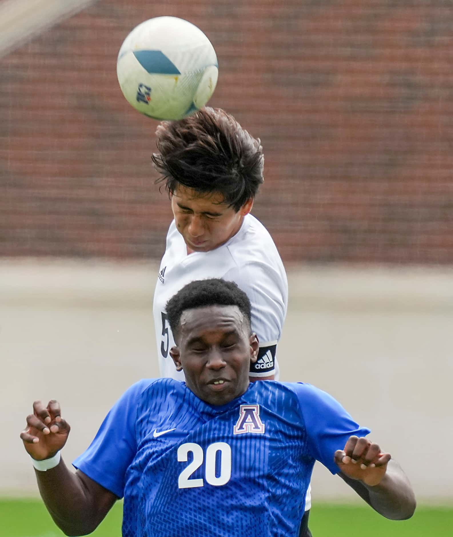 Lake Highlands defender Anthony Licea (5) wins a header over Allen forward Osiramah Iyamah...