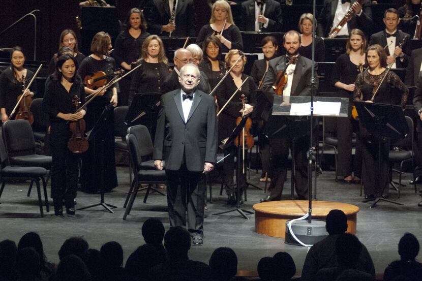 Maestro Anshel Brusilow pauses to acknoledge a standing ovation given him by the Richardson...