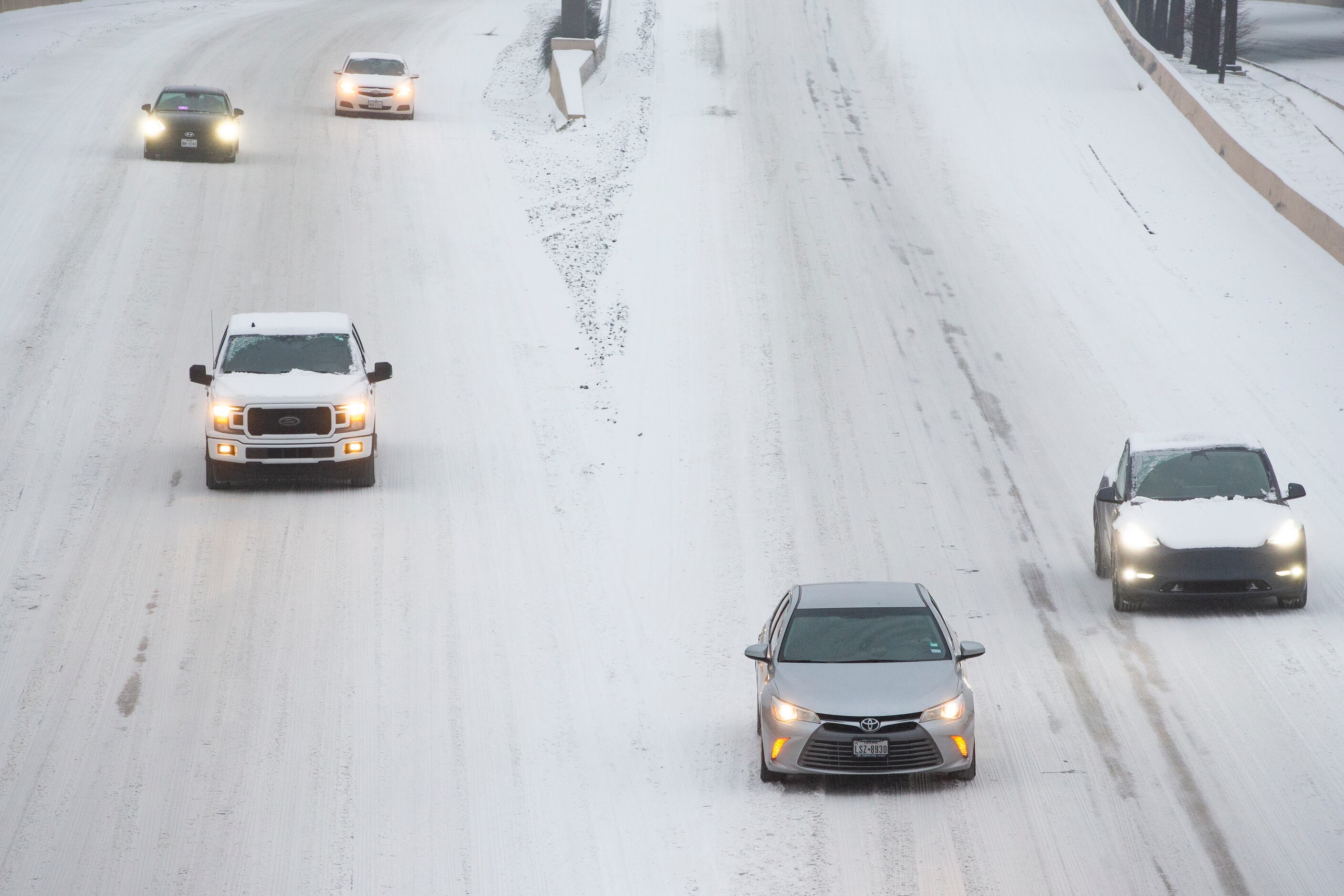 Traffic seen on a snowy and icy North Central Expressway in Dallas on Wednesday, Feb. 17,...