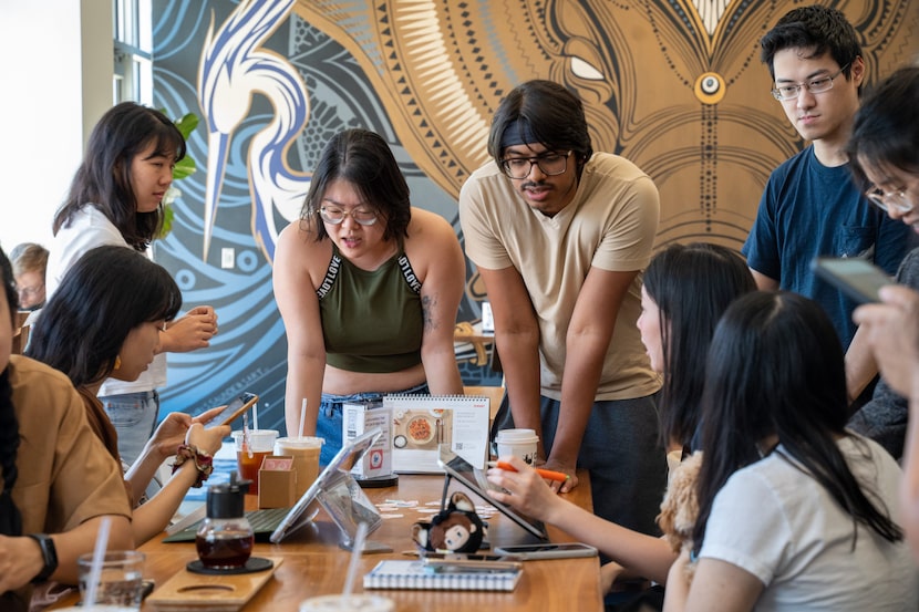 Members of the Dallas Asian American Art Club, including Krishna Narra, talk at a meeting on...