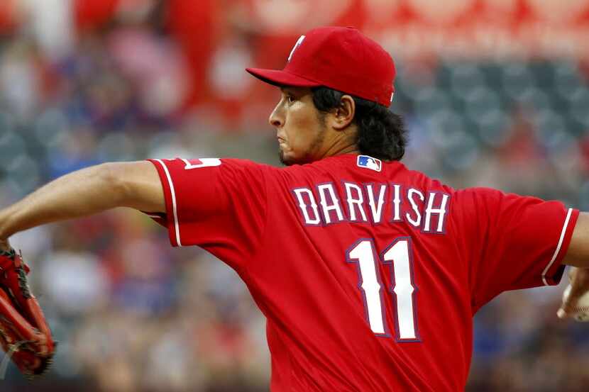 Texas Rangers starting pitcher Yu Darvish throws a pitch against Oakland Athletics during...