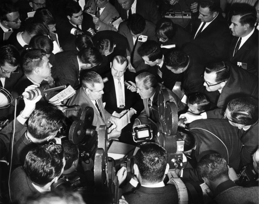 Jack Ruby is surrounded by members of the media during a recess in his trial.  His defense...