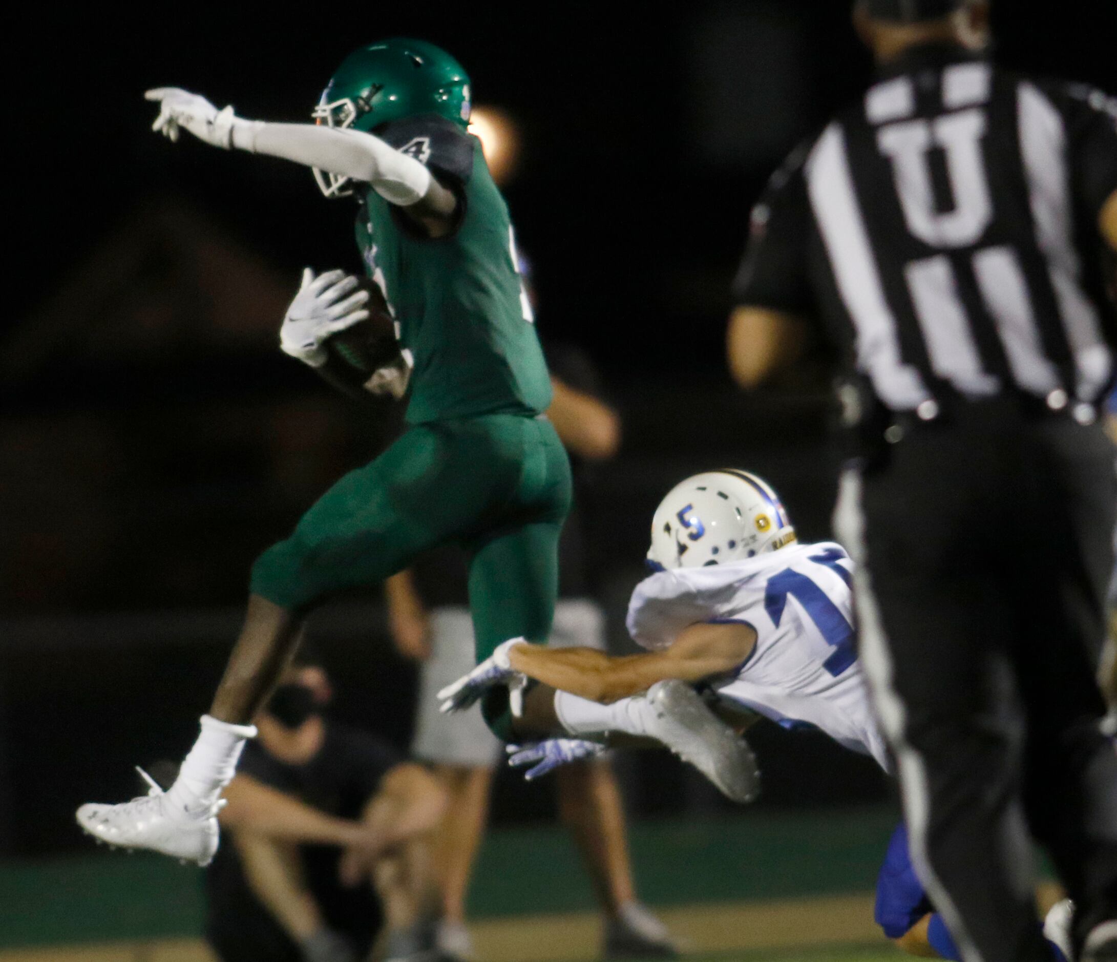 Kennedale running back Ife Ademi (4) leaps away from the tackle attempt of Sunnyvale...