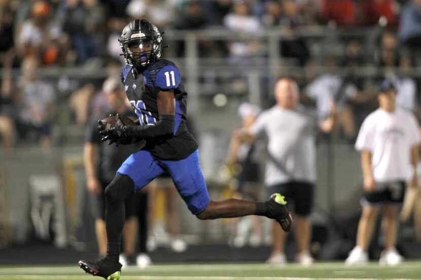 North Forney receiver Jaquarion Robinson (11) races for the end zone on a 51-yard receiving...