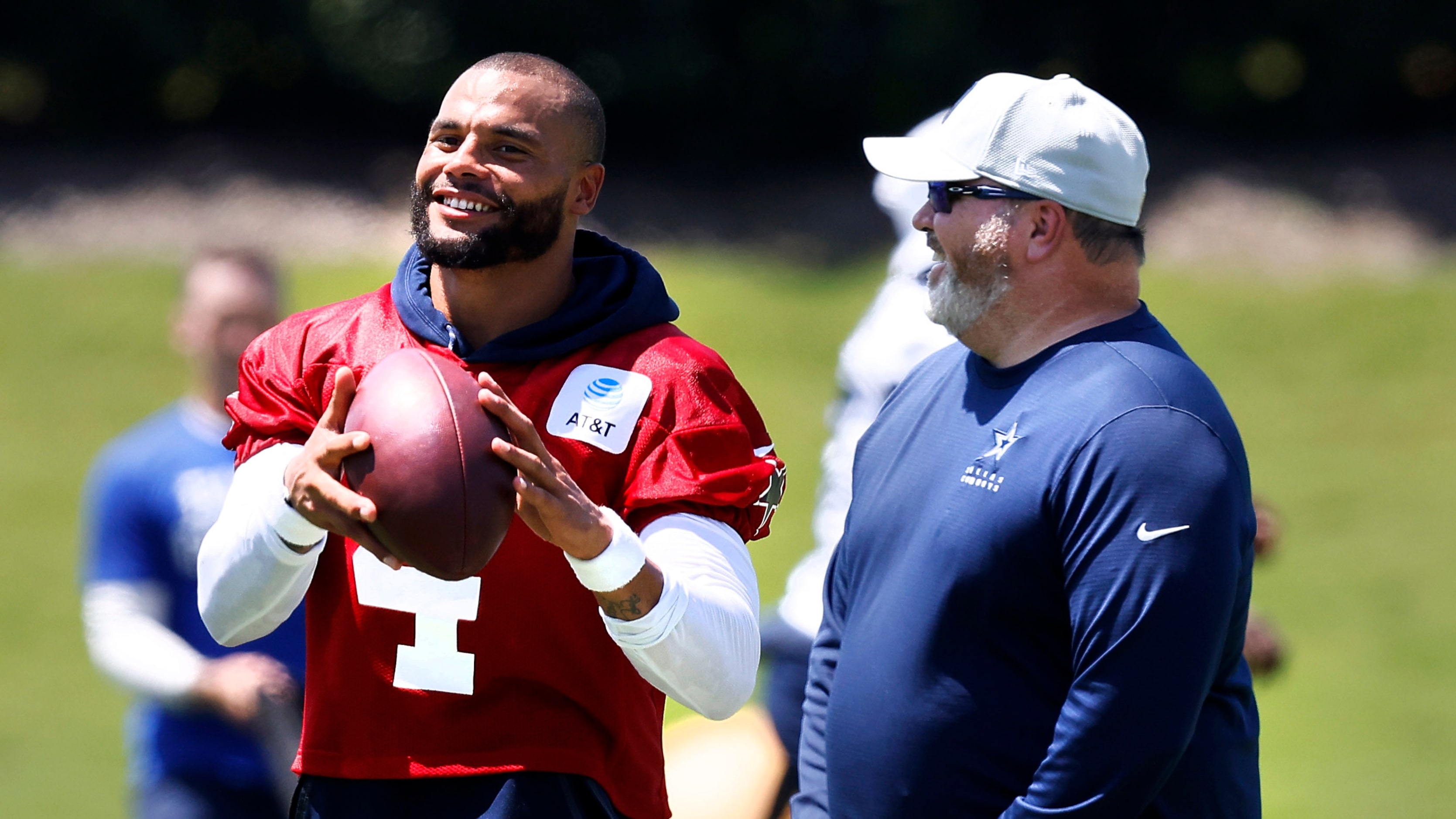 Dallas Cowboys head coach Mike McCarthy and  quarterback Dak Prescott (4) laugh following...