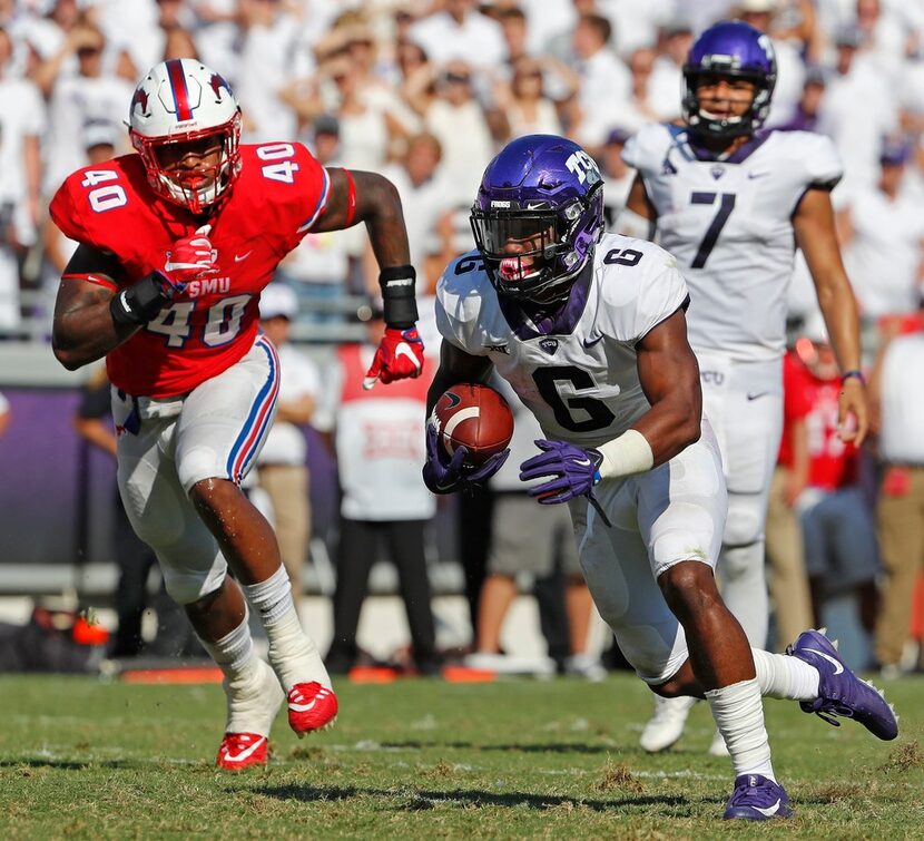 TCU Horned Frogs running back Darius Anderson (6) runs for a third quarter touchdown after a...