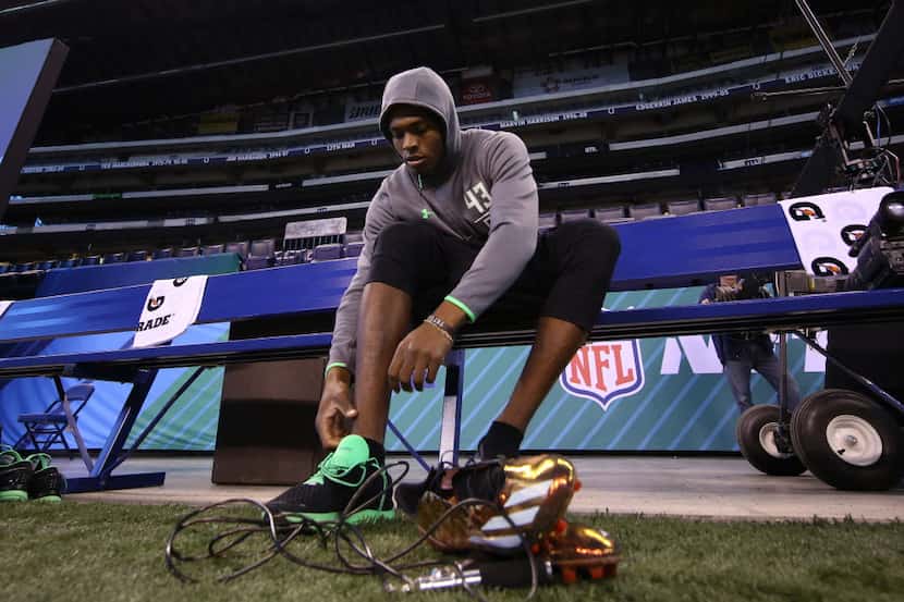 Florida State Seminoles defensive back Jalen Ramsey changes his shoes during the 2016 NFL...
