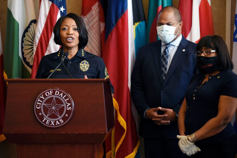 Dallas Chief of Police Renee Hall, left, and Dallas Mayor Eric Johnson, right, conduct a...